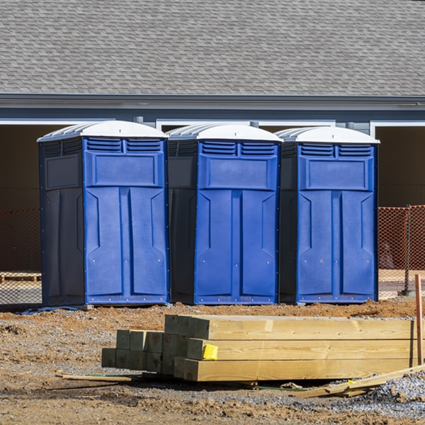 what is the cost difference between standard and deluxe porta potty rentals in Garrison Montana